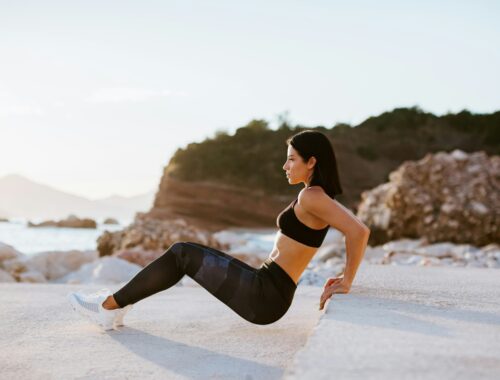 beautiful athletic woman working out outdoors