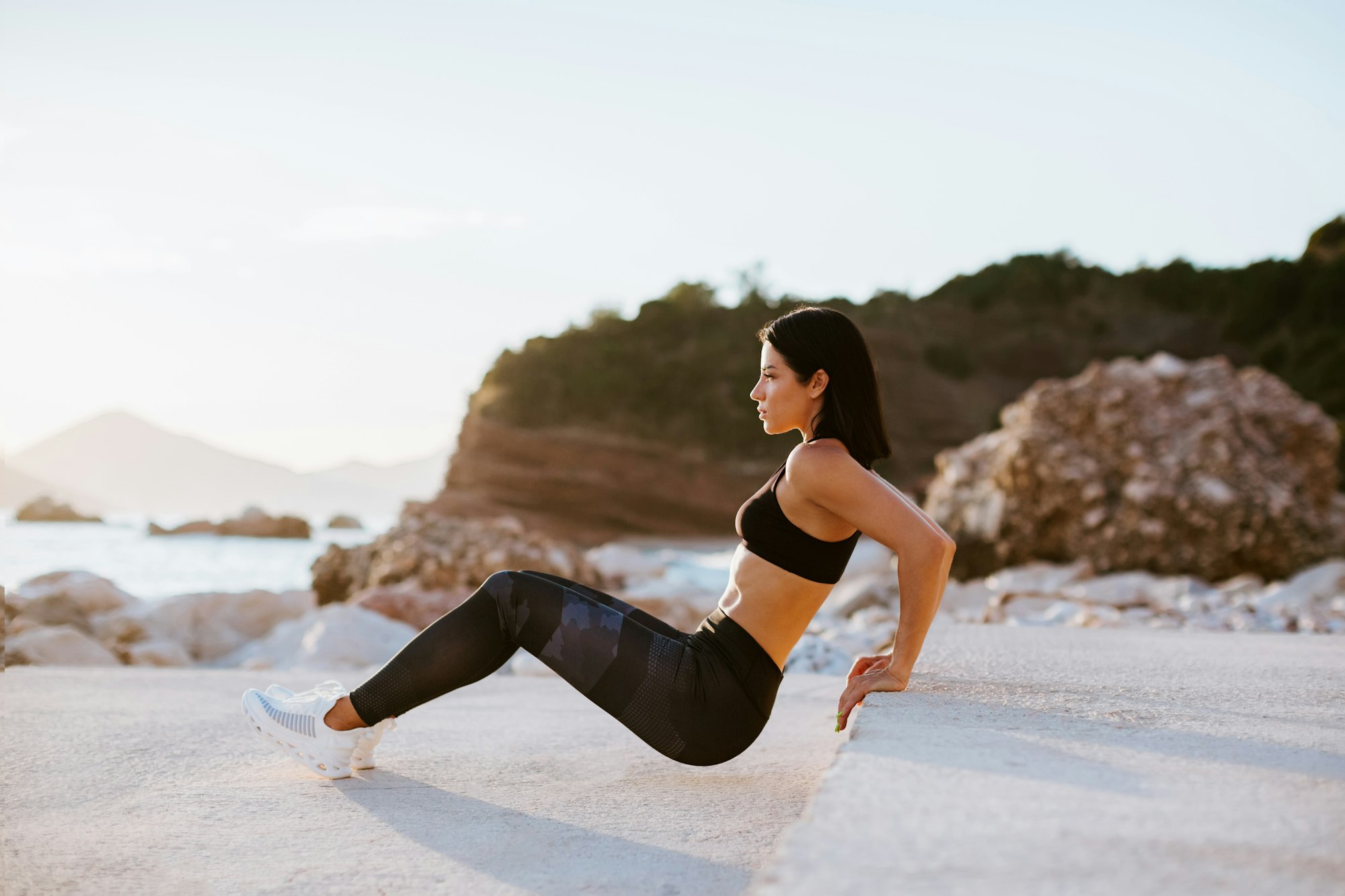 beautiful athletic woman working out outdoors